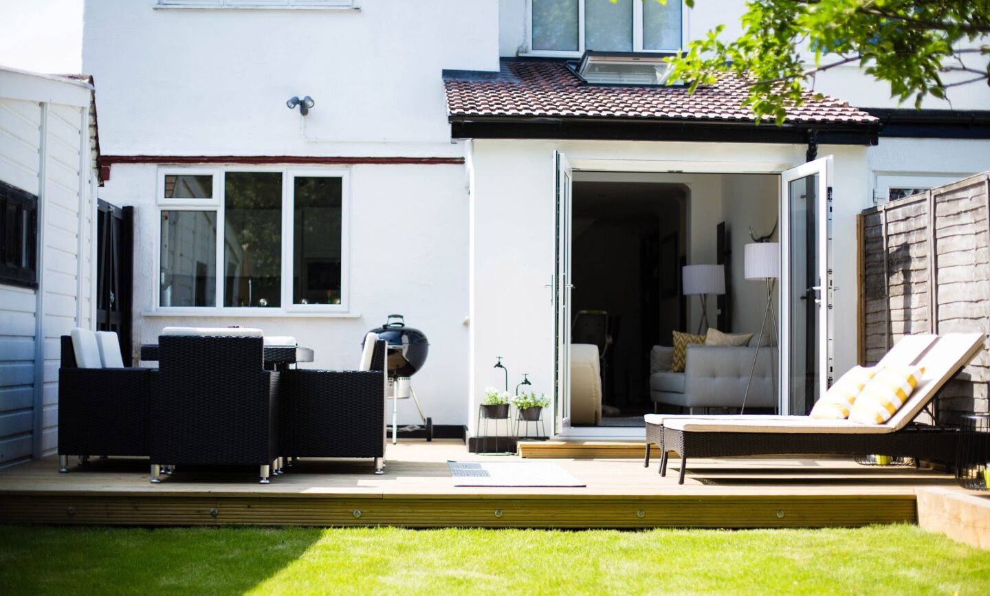 1930s semi detached house exterior with garden and decking area