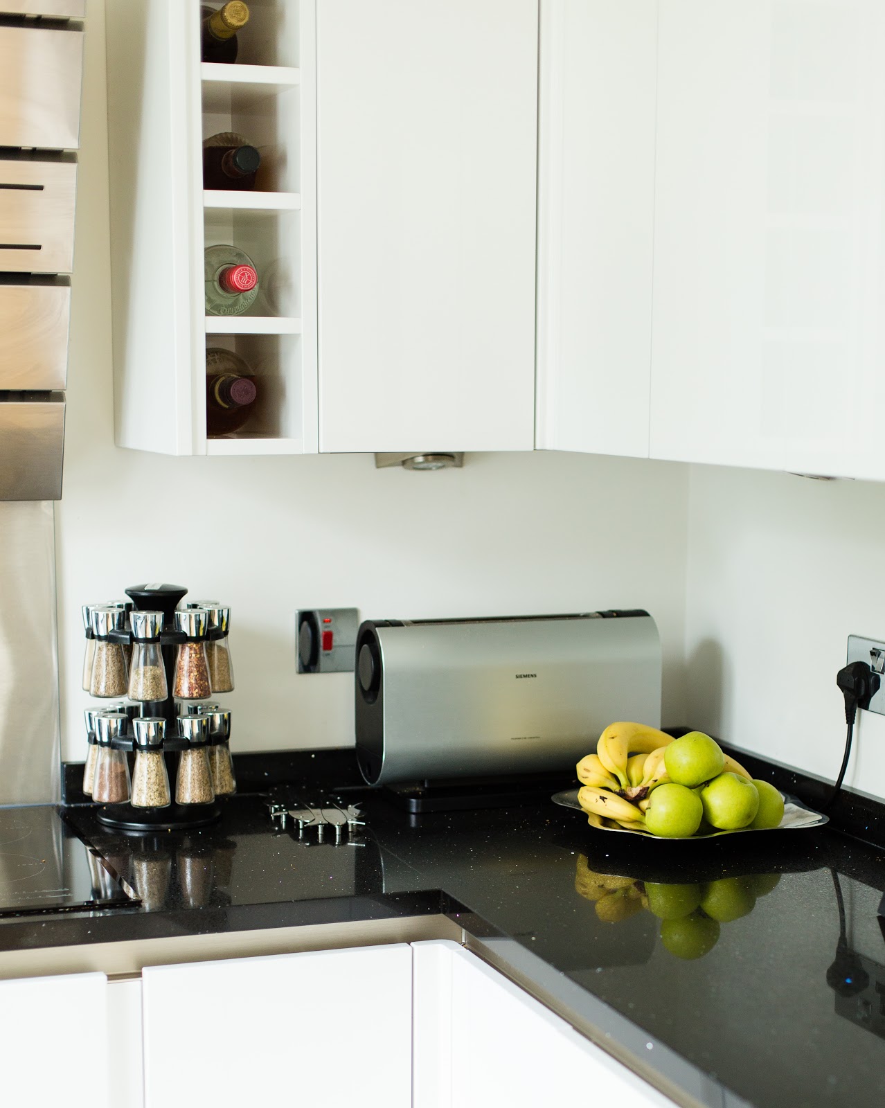 Quartz kitchen worktop installation with dark stone surface and modern fitted Magnet kitchen units