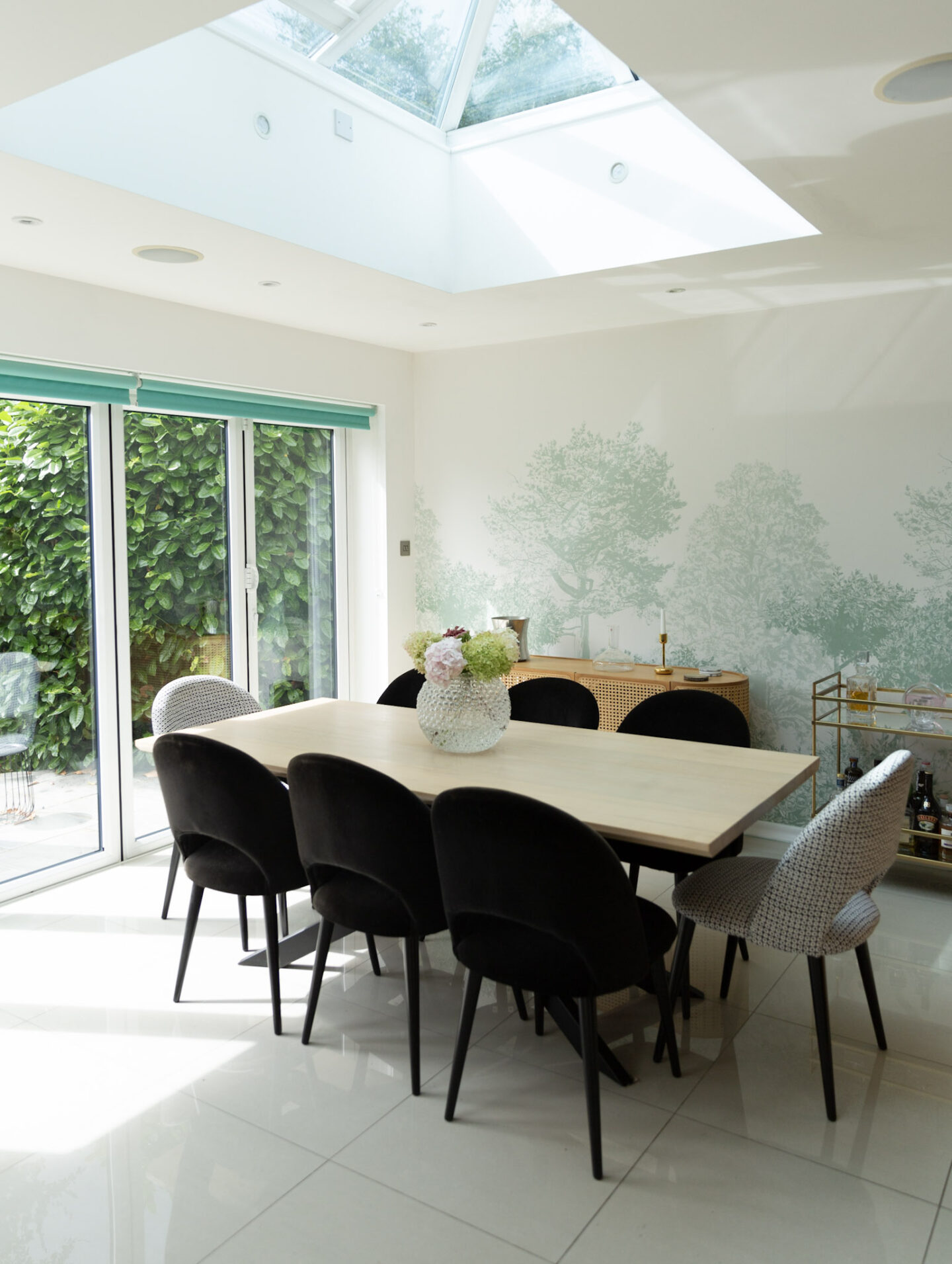 modern dining room featuring smart home technology and sonos speakers throughout into minimalist decor
