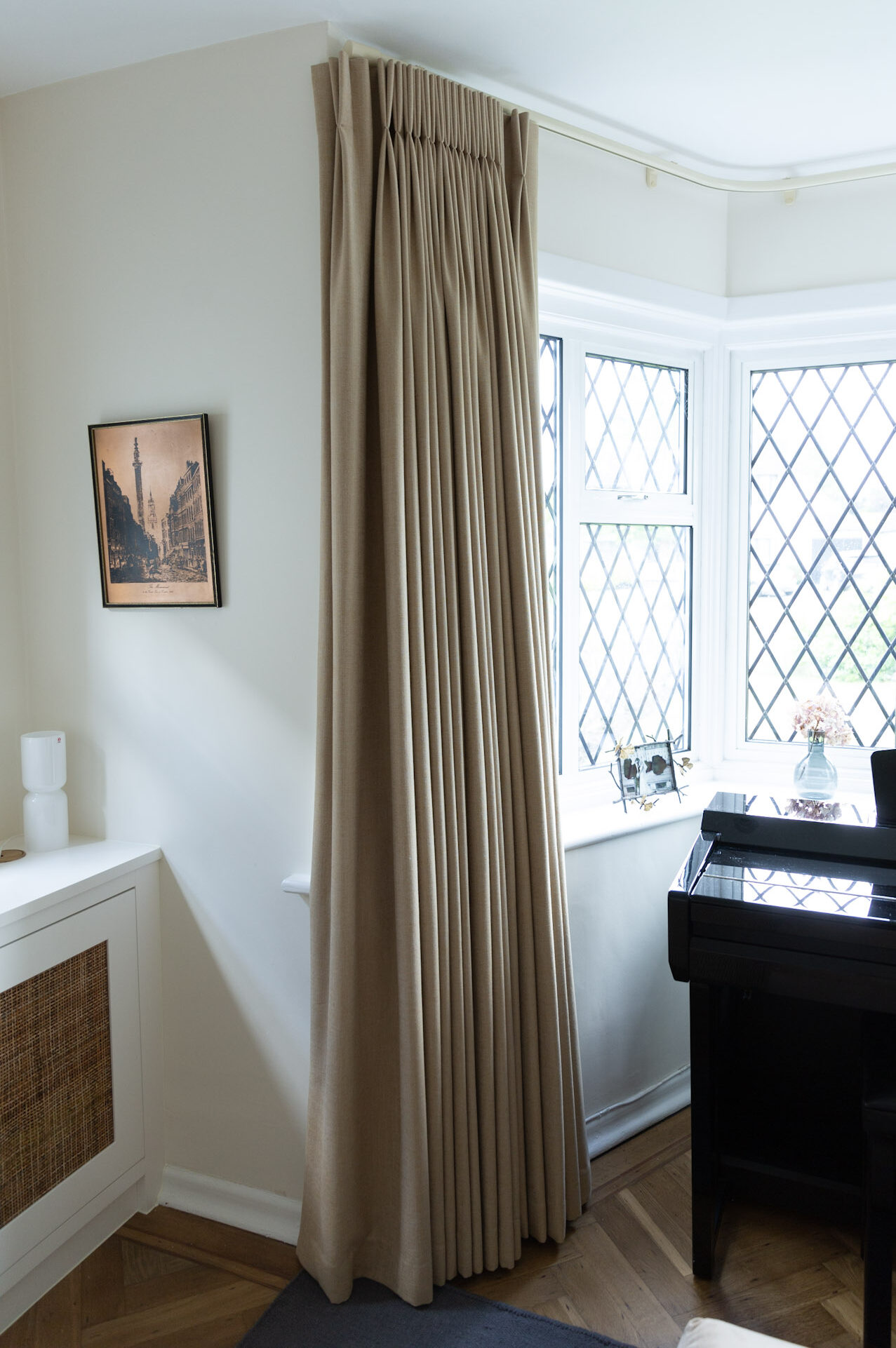 Full-length curtains add warmth and a cosy feel to a living room during winter.