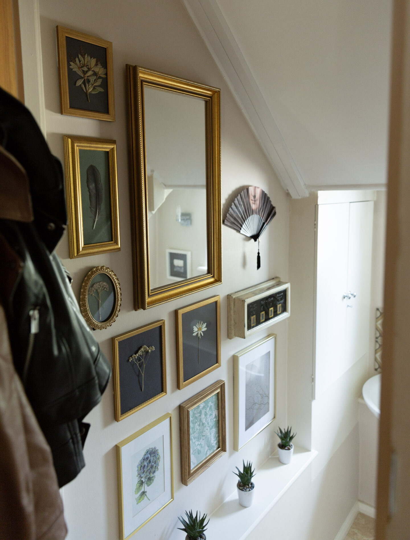 Nature-inspired Eclectic Gallery Wall in Cloakroom using Adhesive Hooks and Strips
