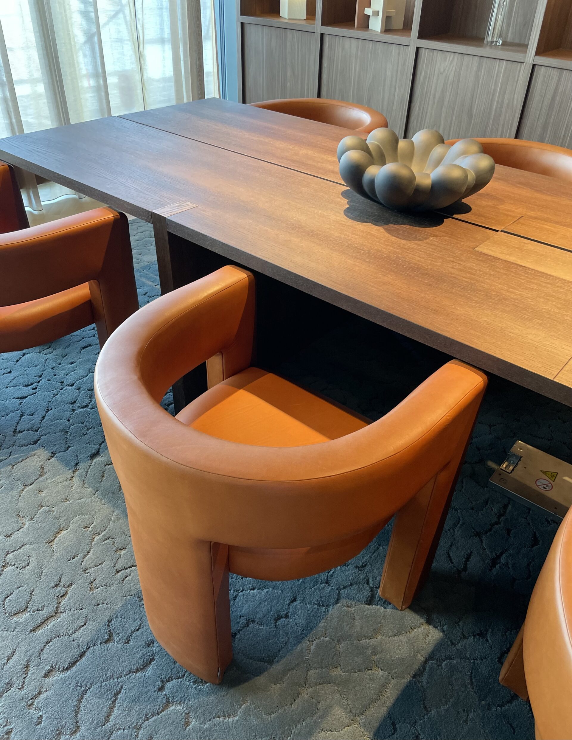 tan upholstered leather armchair