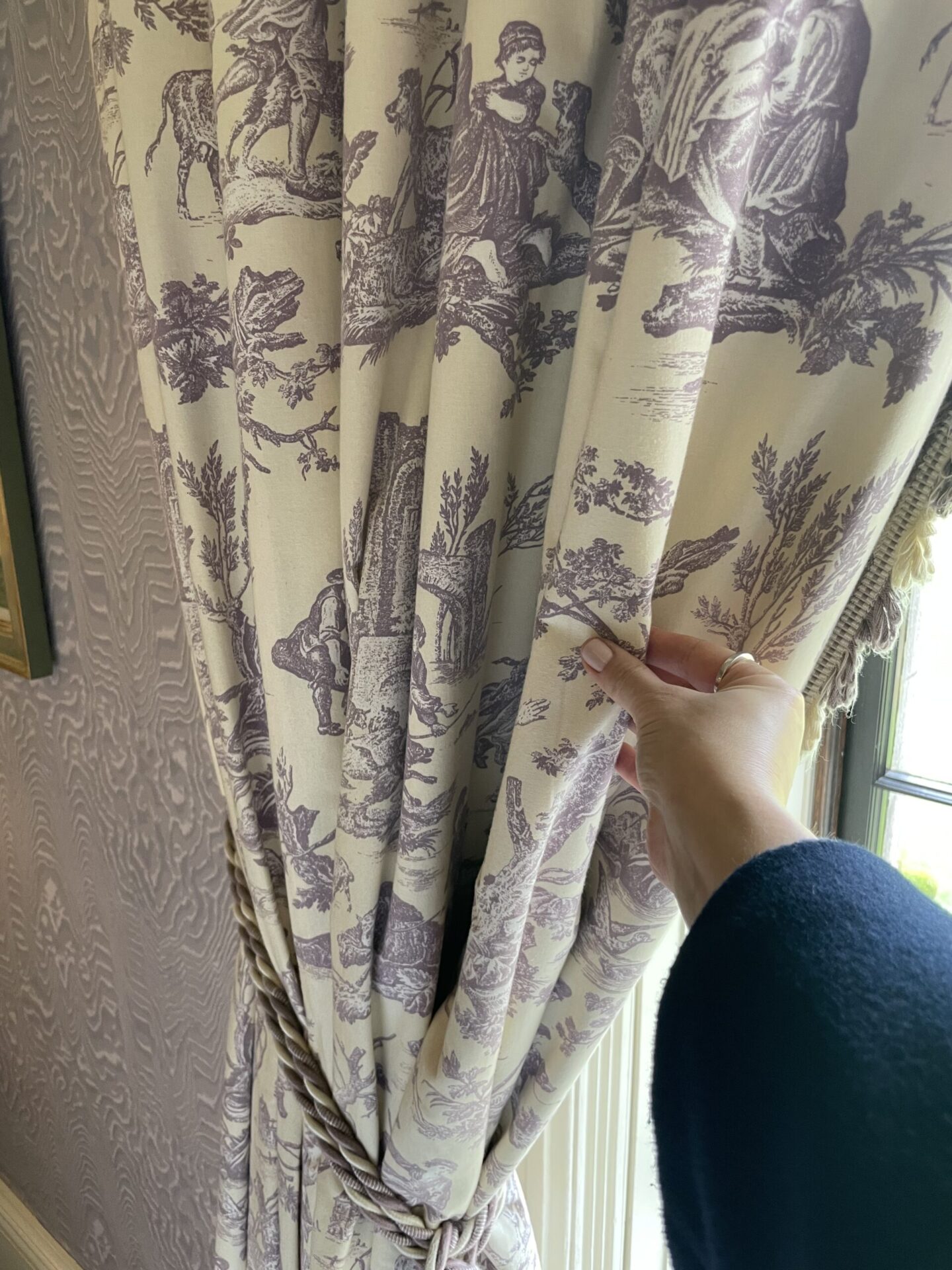 Patterned toile curtains in the bedroom at Ballyfin