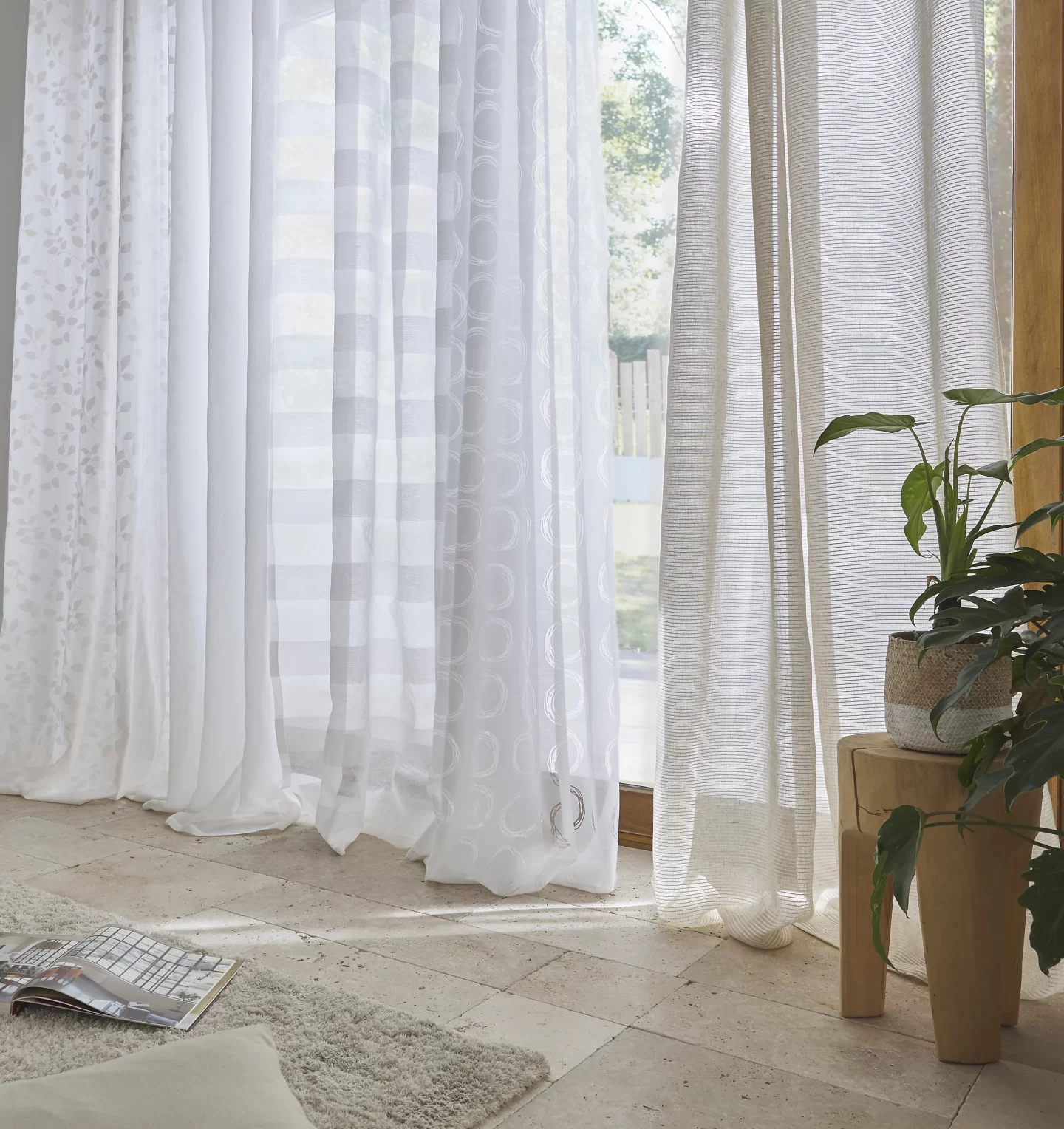 Sheer privacy curtains in a living room. 