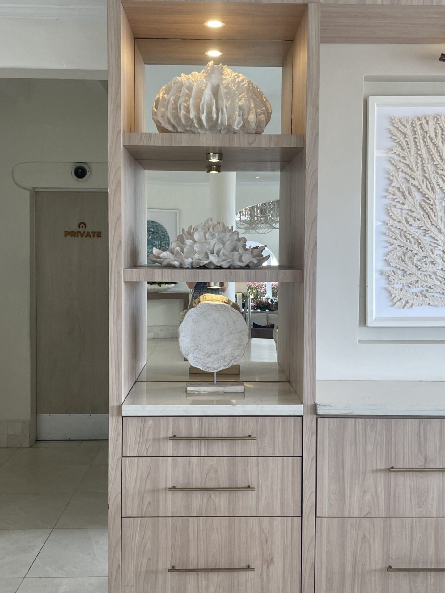 Coastal Ornaments Displayed On A Built-in shelving Unit