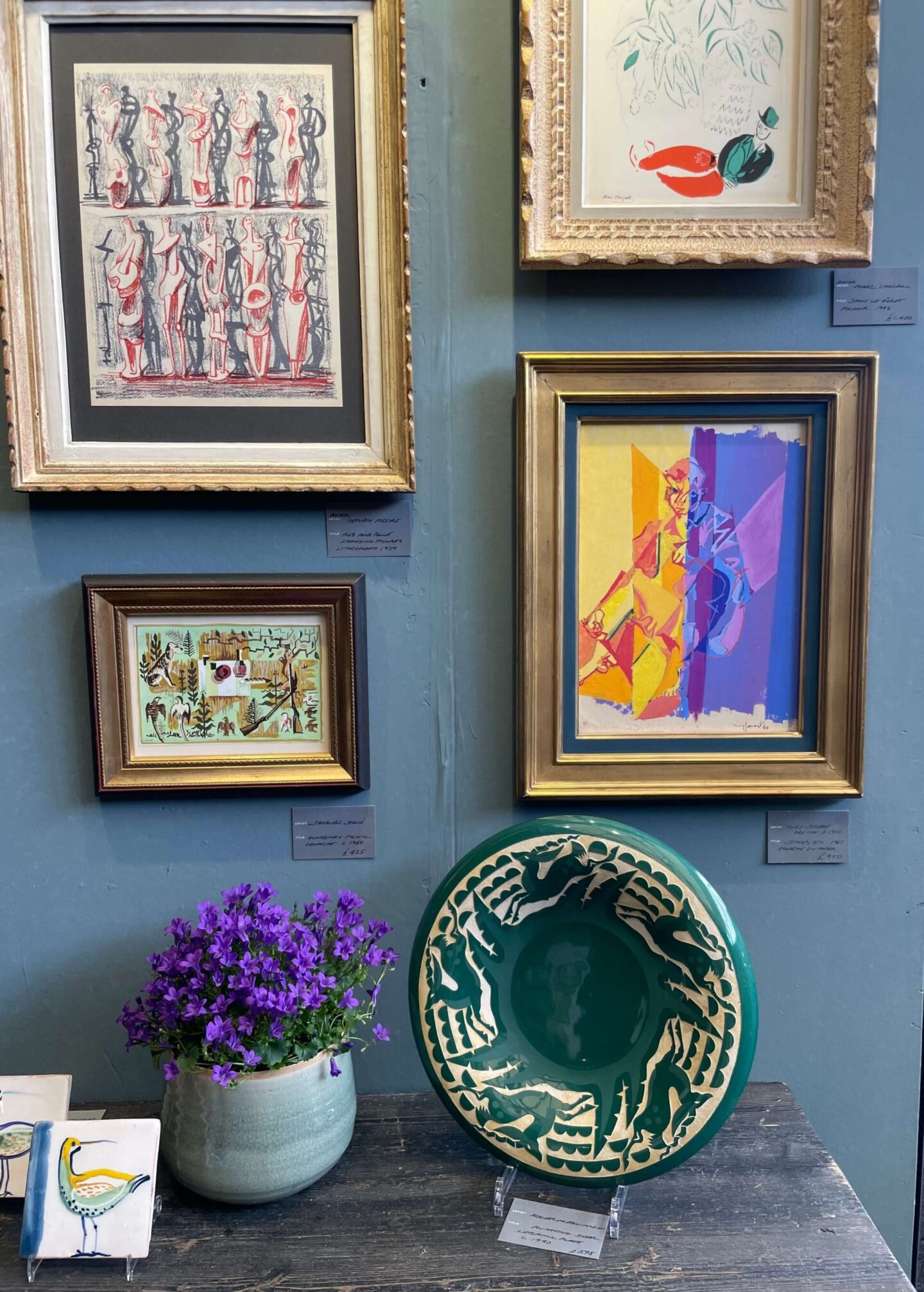 Midcentury art displayed as a gallery wall