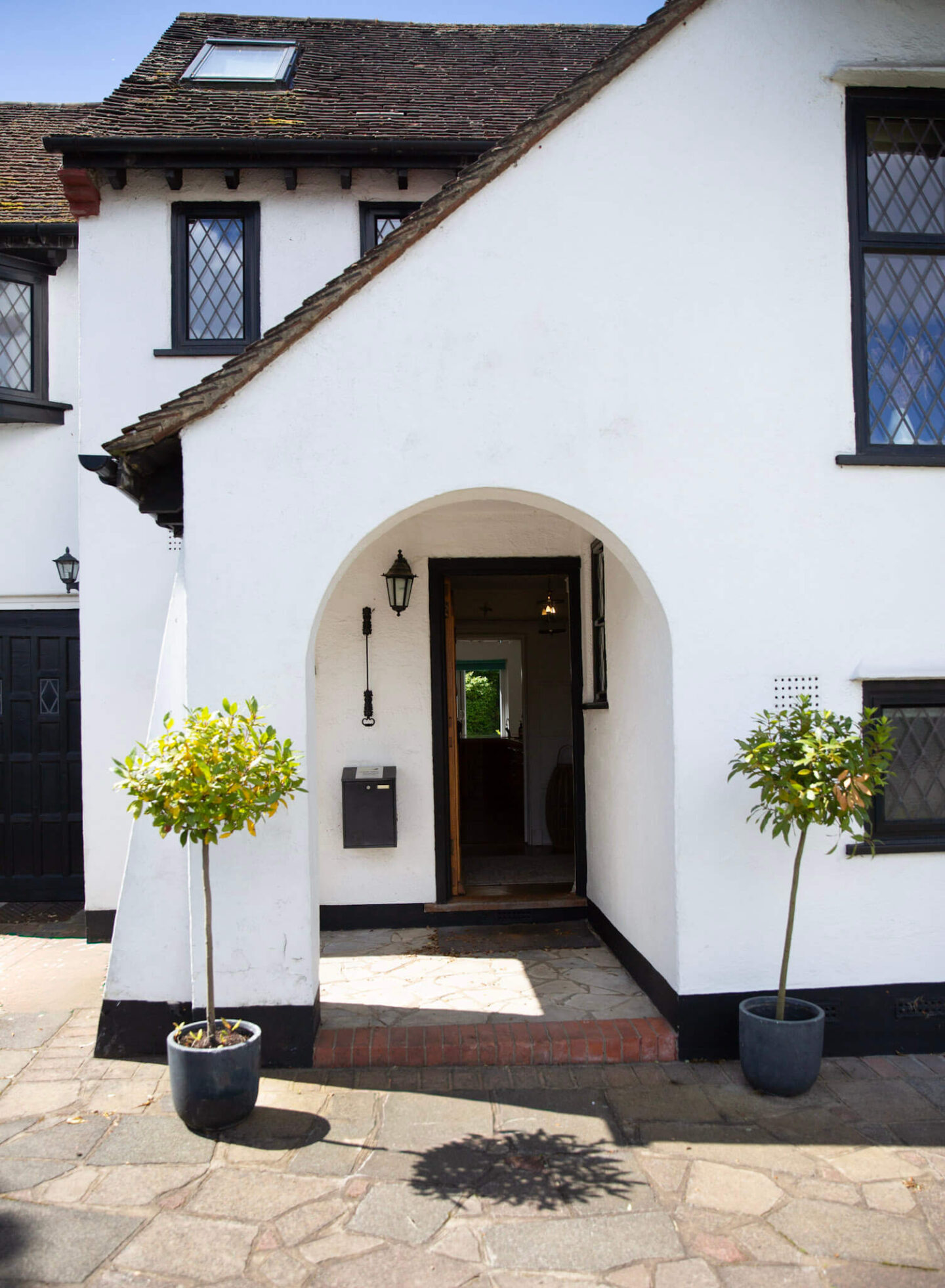 1920s detached house with original arched porch in London suburbs 