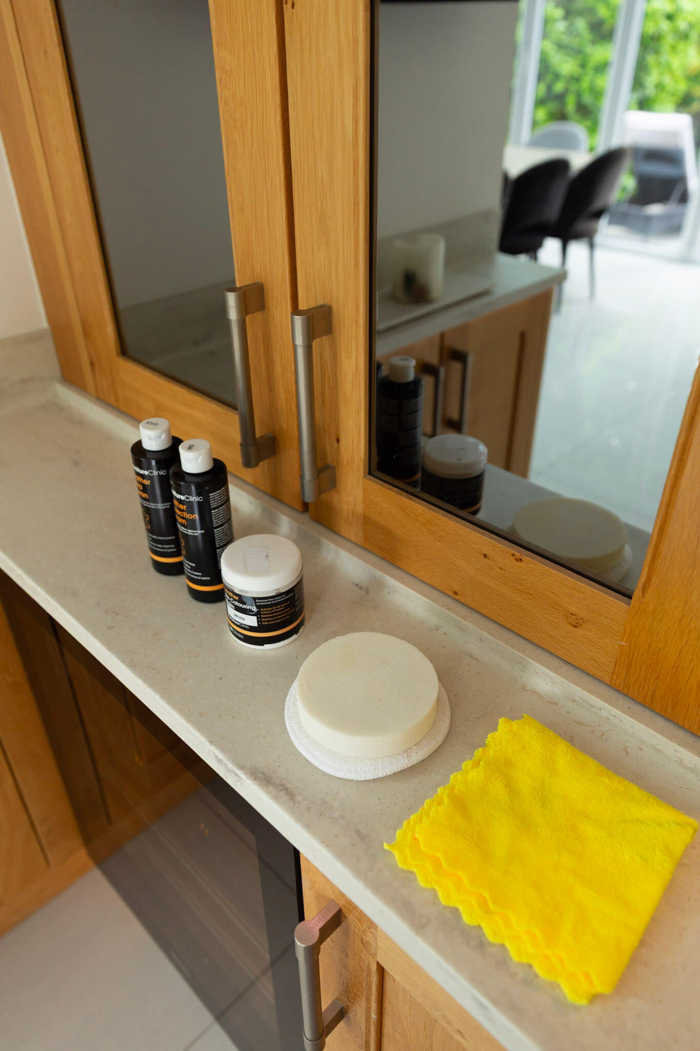 Cleaning sponges, applicator sponge, and microfibre cloth used for leather restoration.