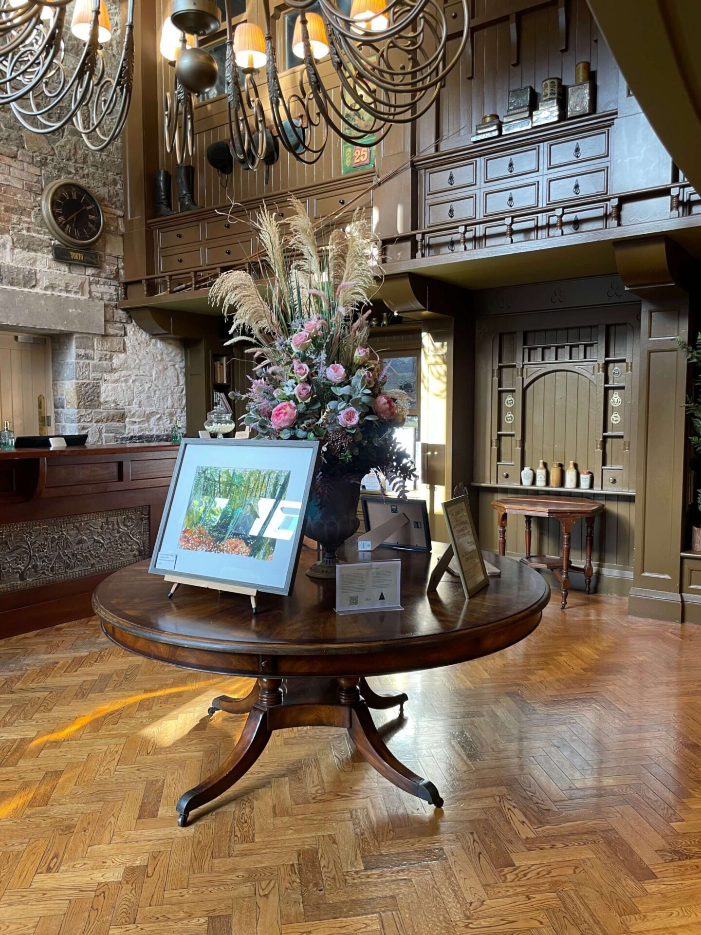 Reception area at The Lodge at Castle Leslie Estate with comfortable seating, wooden furnishings, and country house decor.