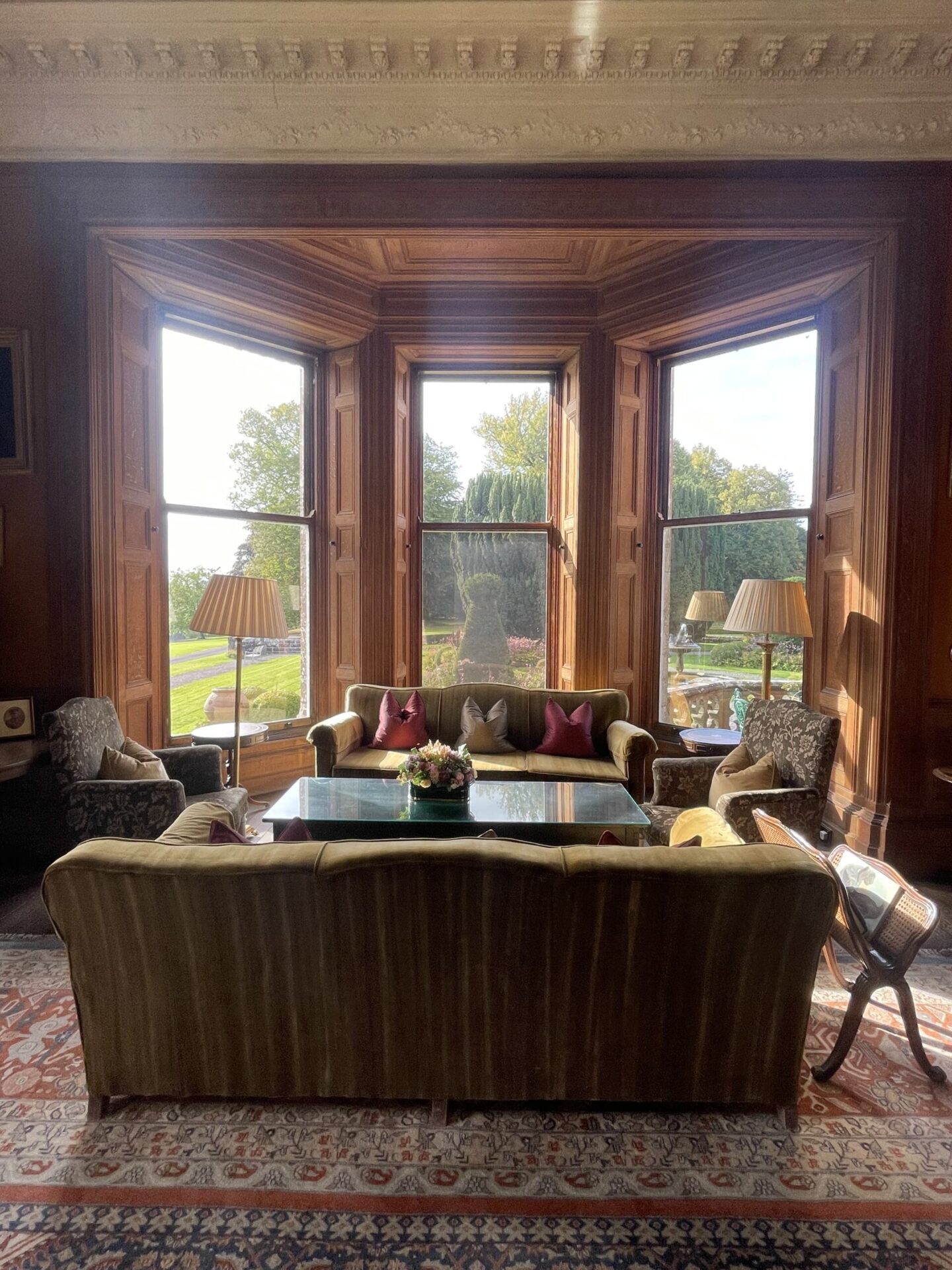 The elegant Drawing Room at Castle Leslie Estate, featuring period decor, ornate furnishings, upholstered sofas and classic country house interiors.