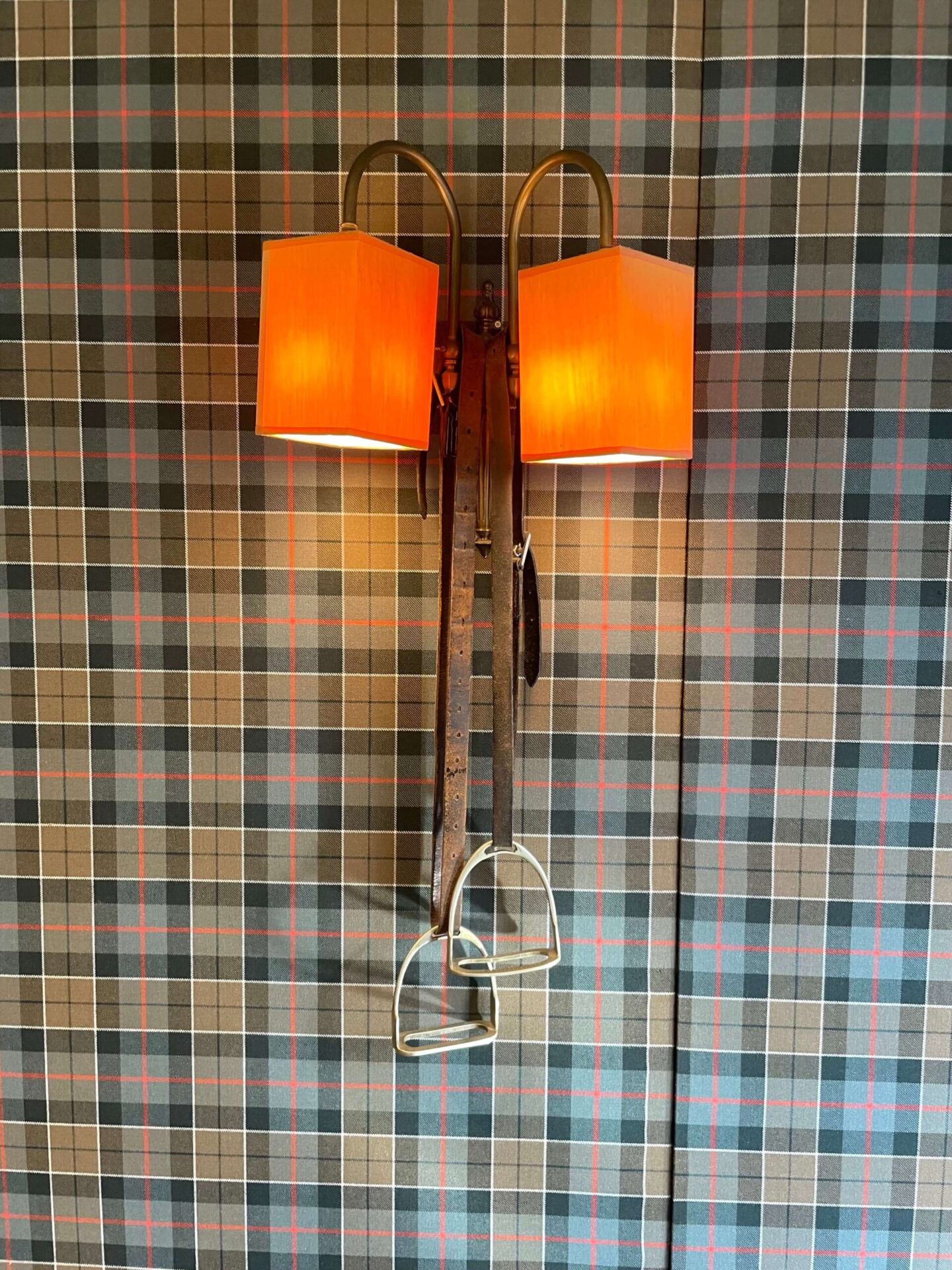 Horse stirrup wall light as part of the equestrian-themed decor at The Lodge, Castle Leslie Estate.