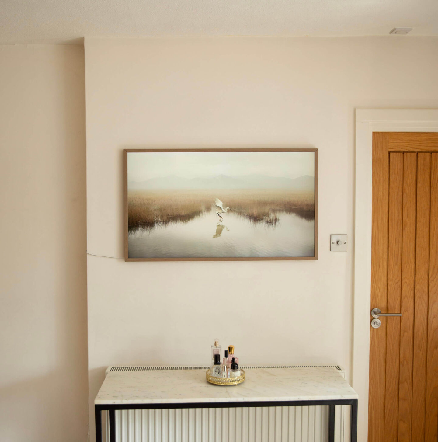 Samsung Frame TV with Teak Bezel in a period home bedroom.