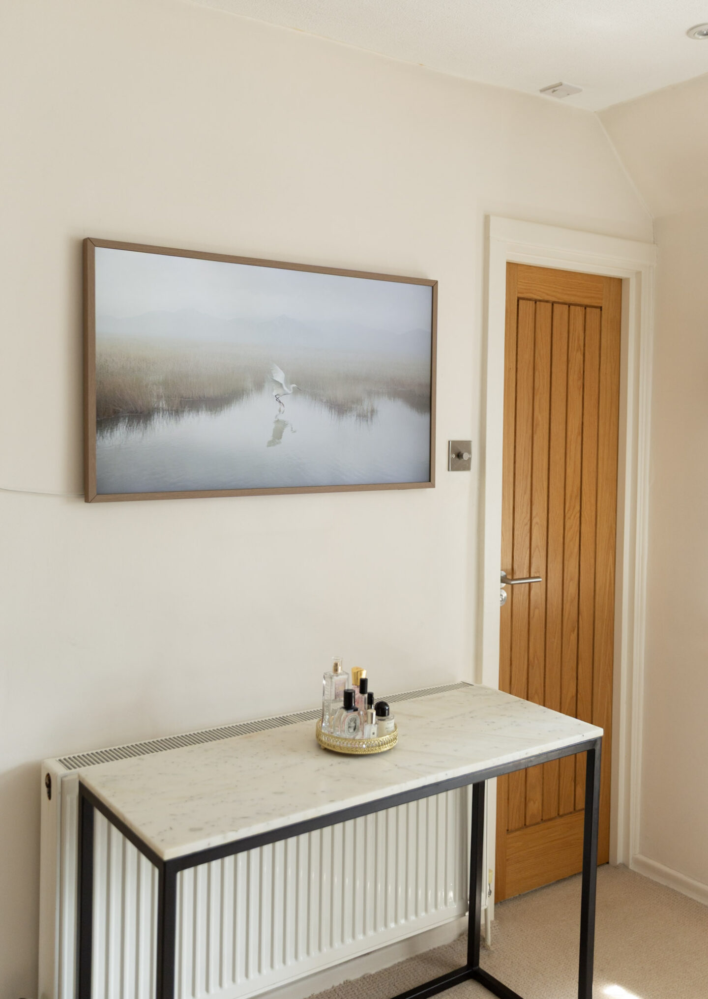 Samsung Frame TV with teak bezel in a bedroom makeover