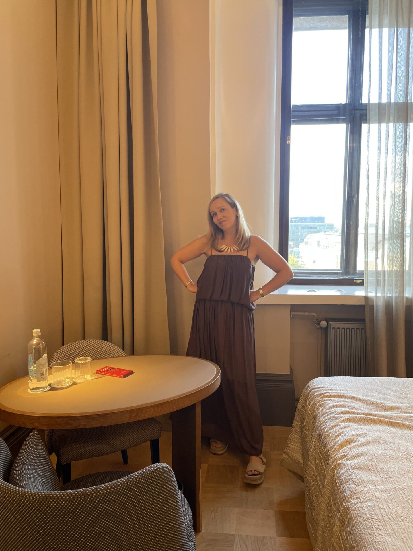 Floor-to-ceiling smart curtains covering the hotel room windows.