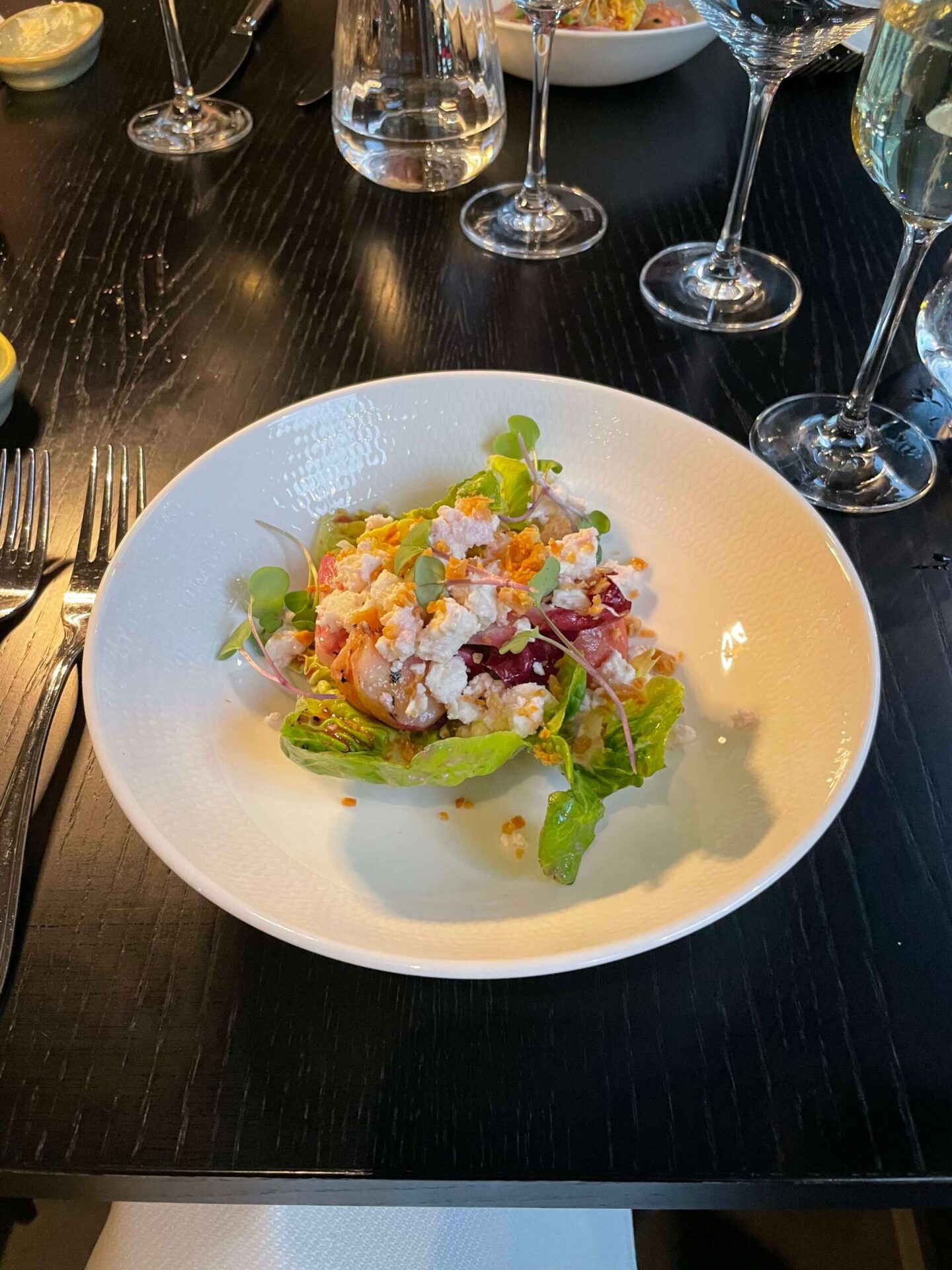 Fresh peach and feta salad served as a starter.