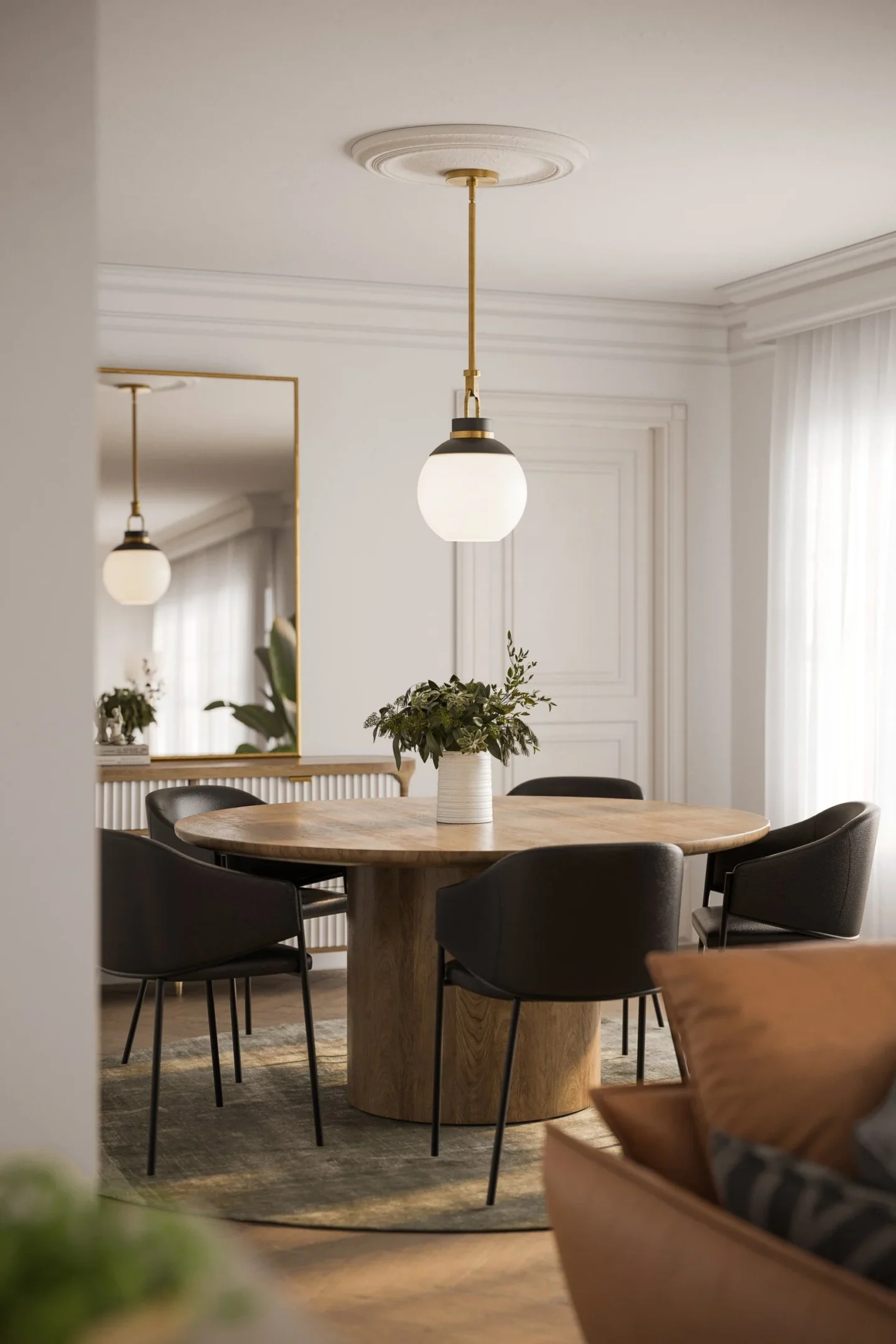 CGI dining room showing a round wooden table with black chairs in a neutral room