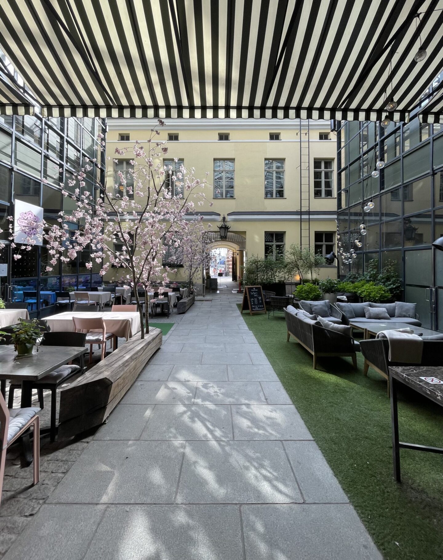 Monochrome black and white courtyard at Hotel Haven Helsinki with greenery