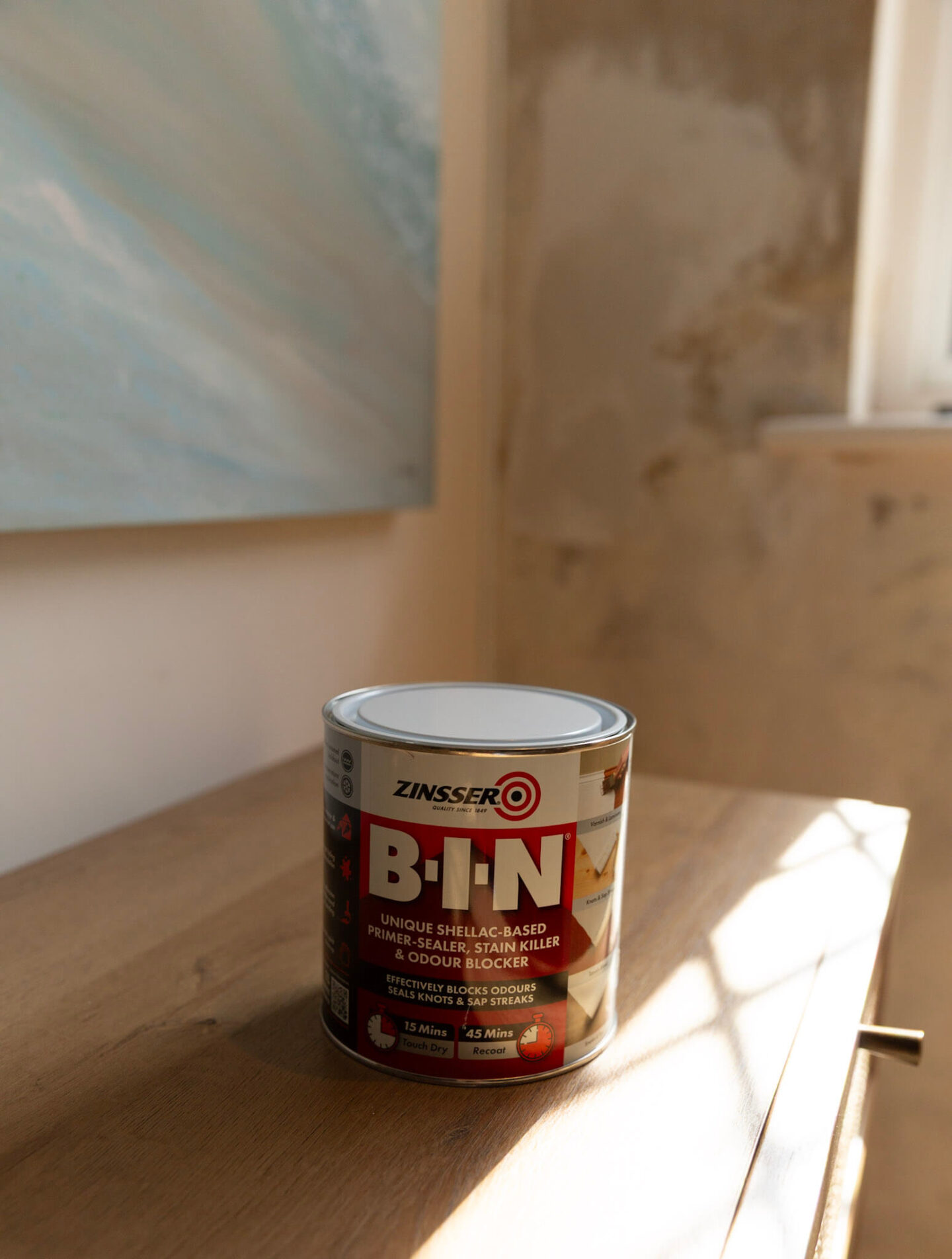 Primer used to seal the wall after mould removal, shown in its container