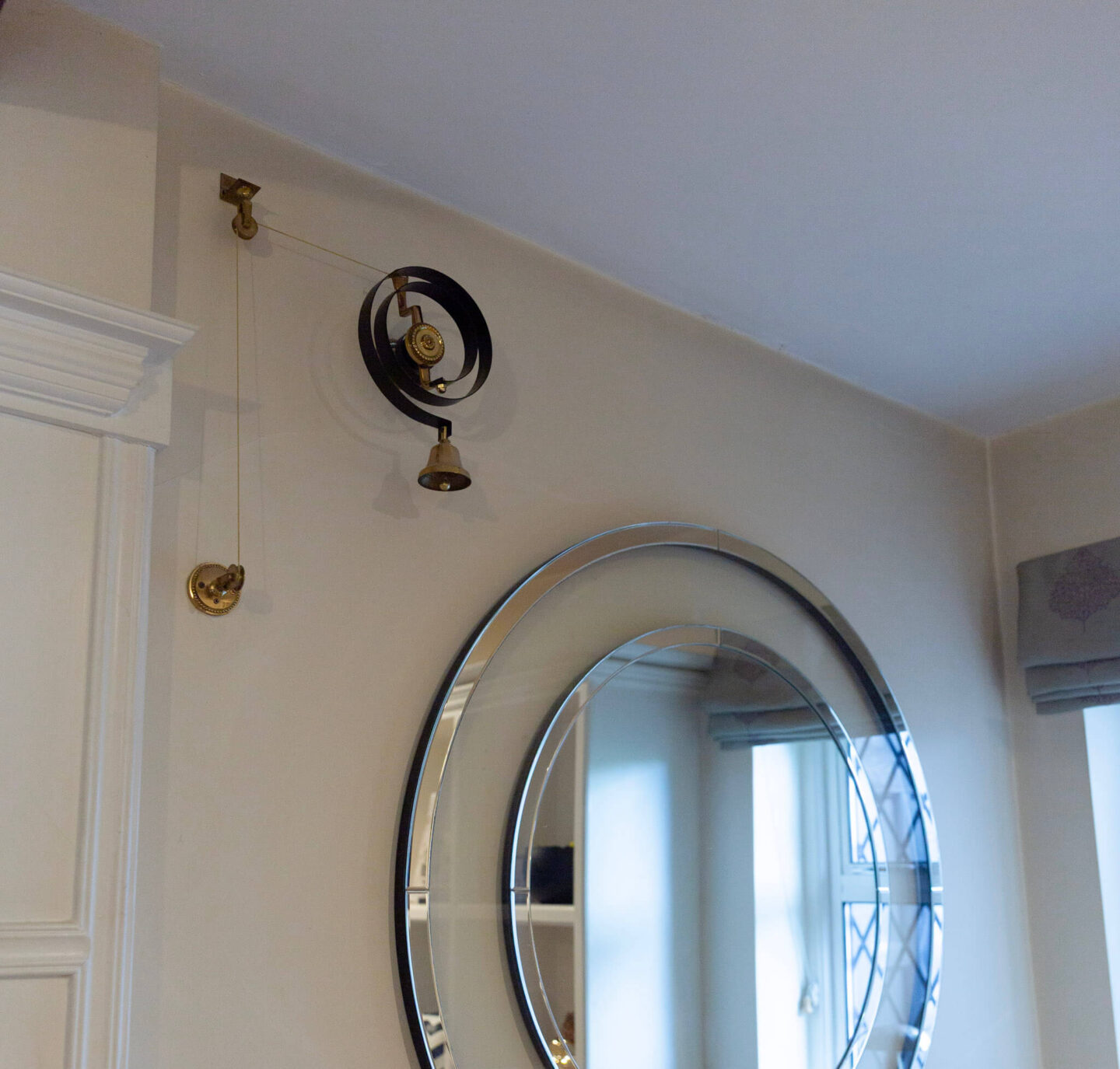 Original butler&rsquo;s bell repurposed as a doorbell in a 1920s period home.