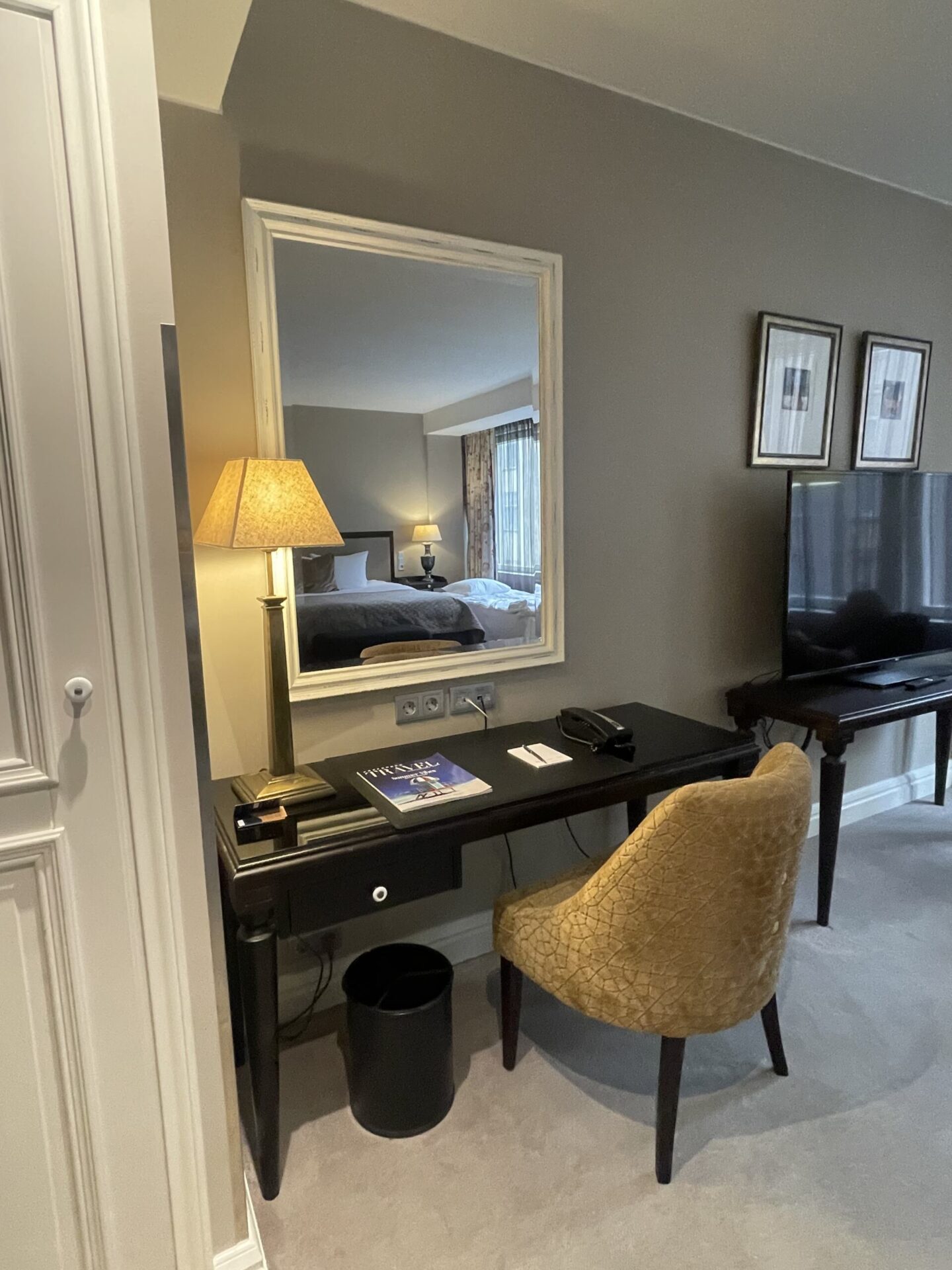 Dark bedroom desk area at Hotel Haven Helsinki with moody interior details